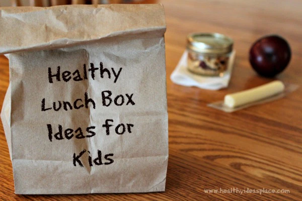 A brown paper lunch sack with the words 