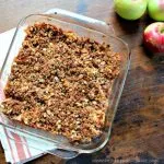 Maple Walnut Apple Crisp in a clear square baking dish