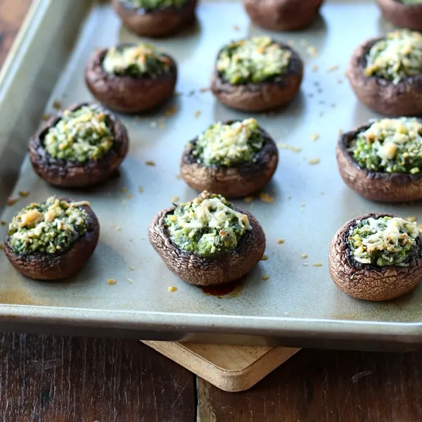 Stuffed Mushrooms with Spinach and Parmesan - on a baking sheet, fresh from the oven