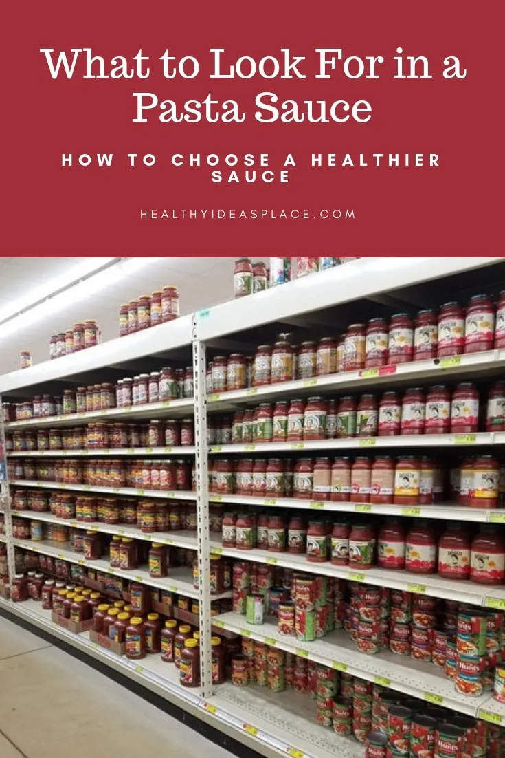 Grocery store shelves filled with different kinds of pasta sauce