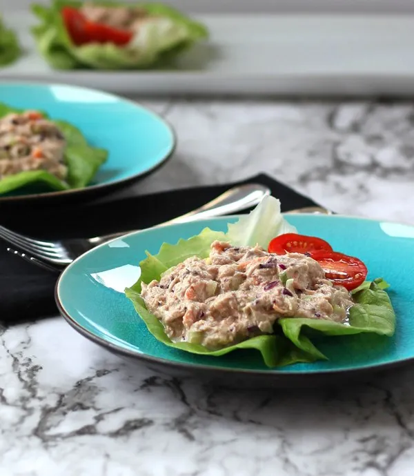Two blue plates with Tuna Salad Lettuce Wraps