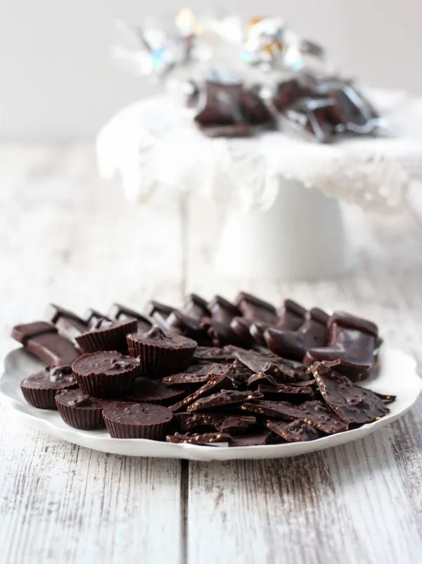 homemade dark chocolate candies on a white plate with a white background