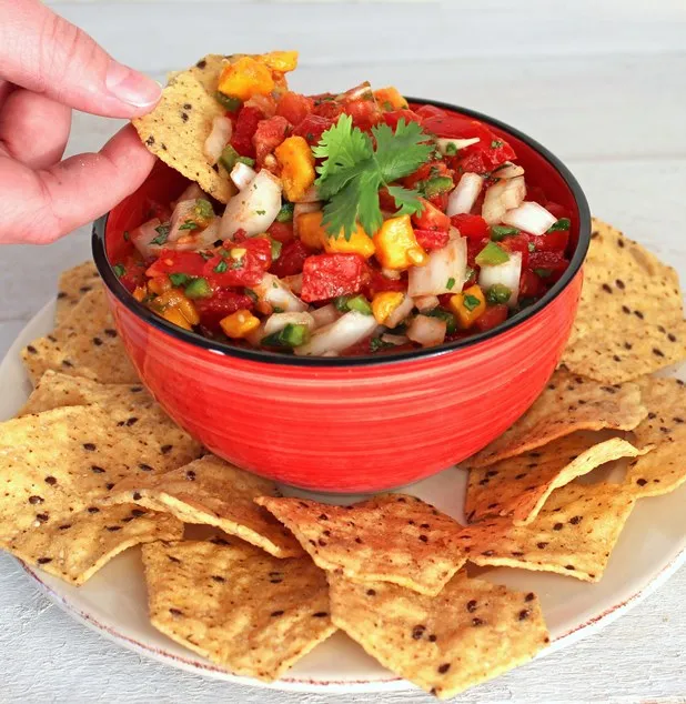 Homemade Salsa with Tomatoes and Mango - Fresh tomatoes and mango make a healthy, savory-sweet salsa with lots of flavor and a touch of heat.