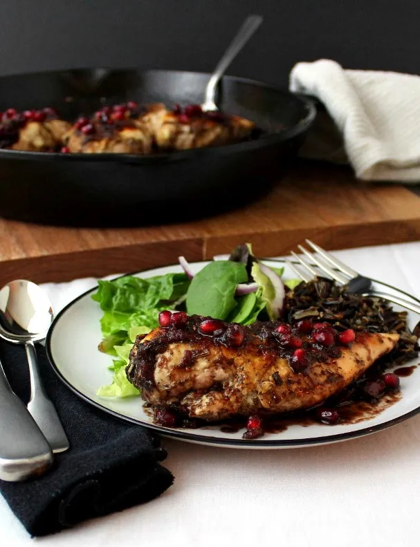 Pomegranate-Cranberry Chicken - Tender cooked chicken breasts topped with a sweet and spicy pomegranate-cranberry sauce with just the right touch of heat.