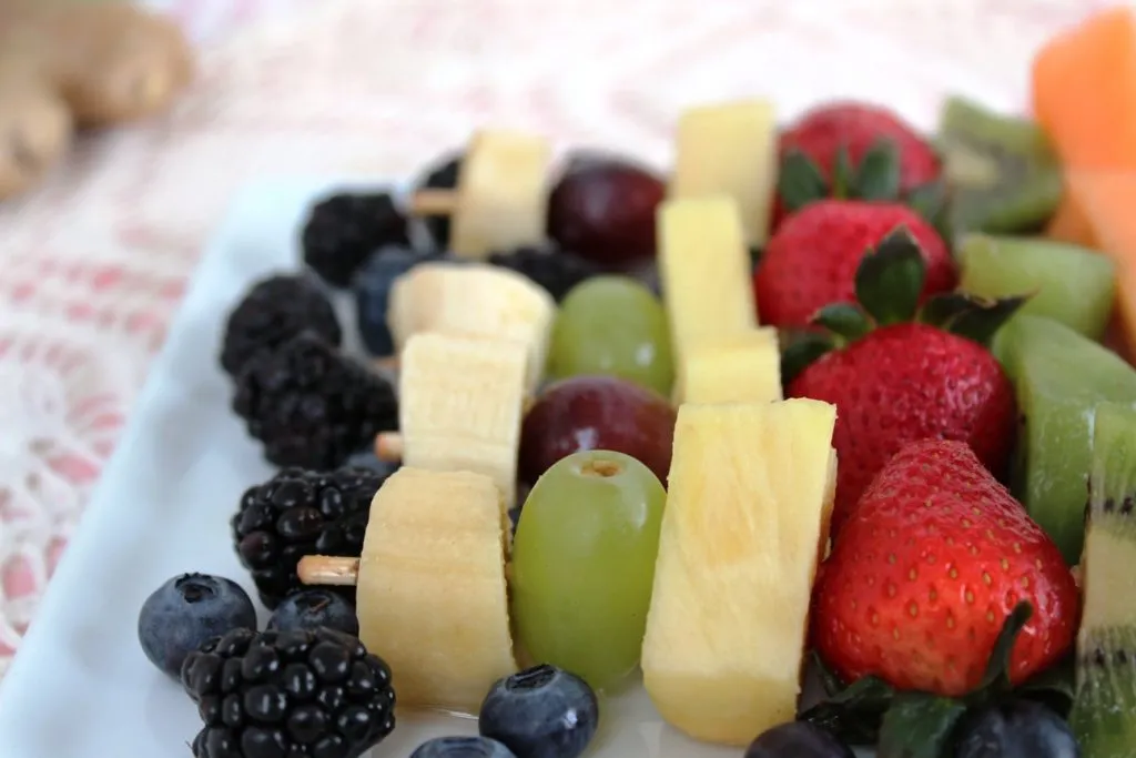 Fruit Kebabs with Honey-Lime-Ginger Vinaigrette on platter