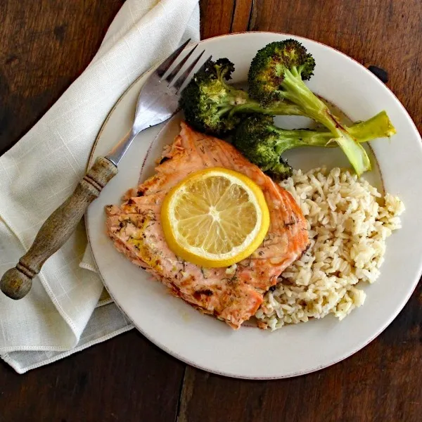 Seasoned with lemon, garlic, and dill, Baked Salmon with Lemon-Dill Sauce is nourishing, heart healthy, delicious, and quick and easy to prepare.