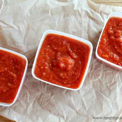 Three containers of roasted tomato sauce