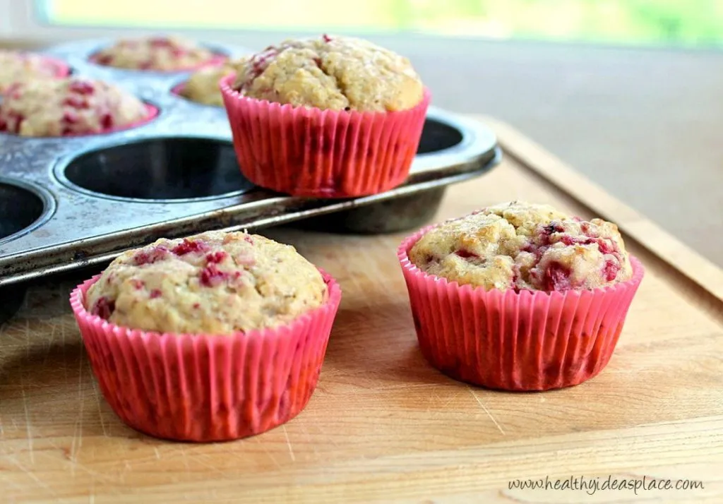 Raspberry Muffins - A summertime treat filled to the brim with sweet raspberries, a hint of lemon, and nourishing whole grains.