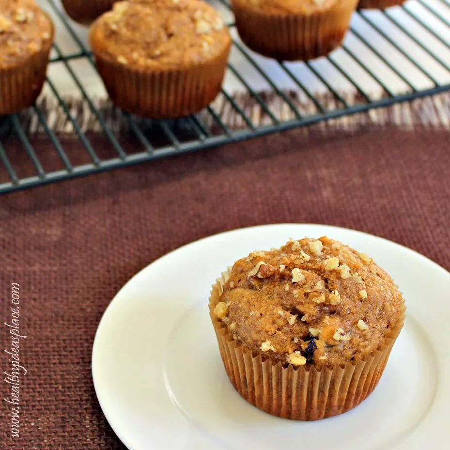 Closeup of a pumpkin chai muffin on a white plate