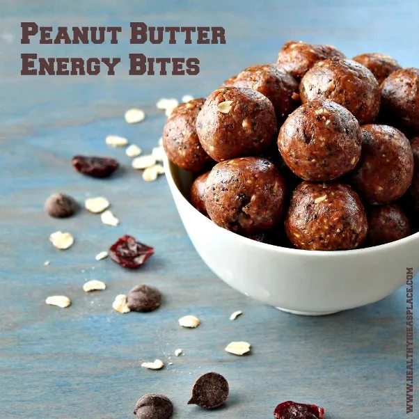 Peanut Butter Energy Bites in a white bowl on a blue bakground