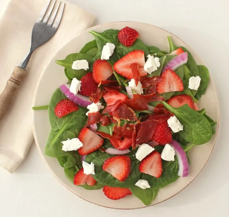 Strawberry Spinach Salad with Crispy Prosciutto - A delectable salad filled with spinach and strawberries, and topped with prosciutto and homemade vinaigrette