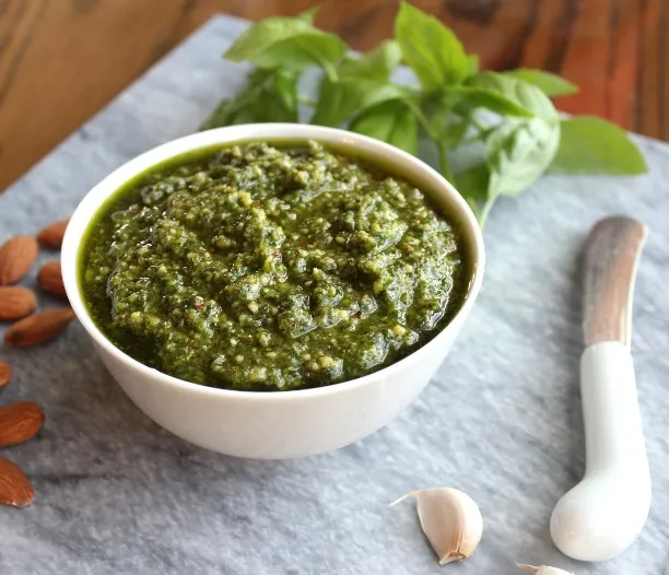 Basil Pesto with Almonds - Tasty and filled with healthy fats, you can stir it into pasta, or use as a marinade, dip, or spread for sandwiches and wraps.