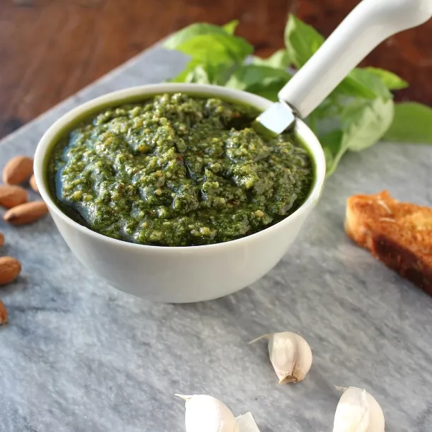 Basil Pesto with Almonds - Tasty and filled with healthy fats, you can stir it into pasta, or use as a marinade, dip, or spread for sandwiches and wraps.