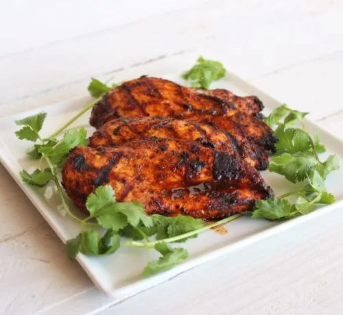 Southwest Grilled Chicken Breasts on a square white plate
