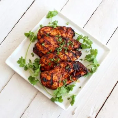 Southwest Grilled Chicken on a square white plate sitting on a white table