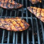 chicken breasts on hot grill