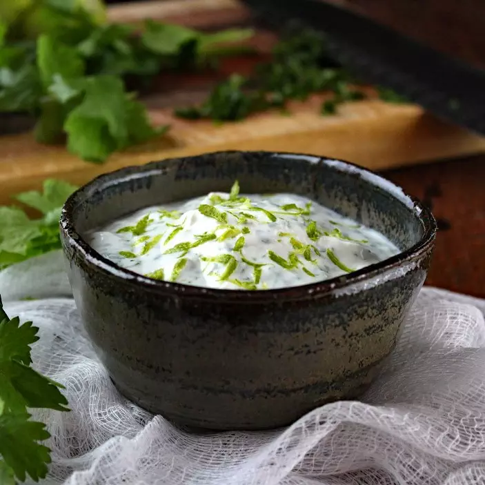 Cilantro Lime Crema – Creamy and tangy, and made with Greek yogurt to make it healthier, it’s a perfect complement to spicy foods or used as a dip for tortilla chips. #dip #GreekYogurt #Healthy