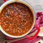 Vegetarian Chili with Red Lentils - Cold days call for a bowl of warm, spicy chili. This healthier vegetarian chili calls for red lentils and lots of veggies instead of meat - perfect for meatless Mondays or any day of the week!