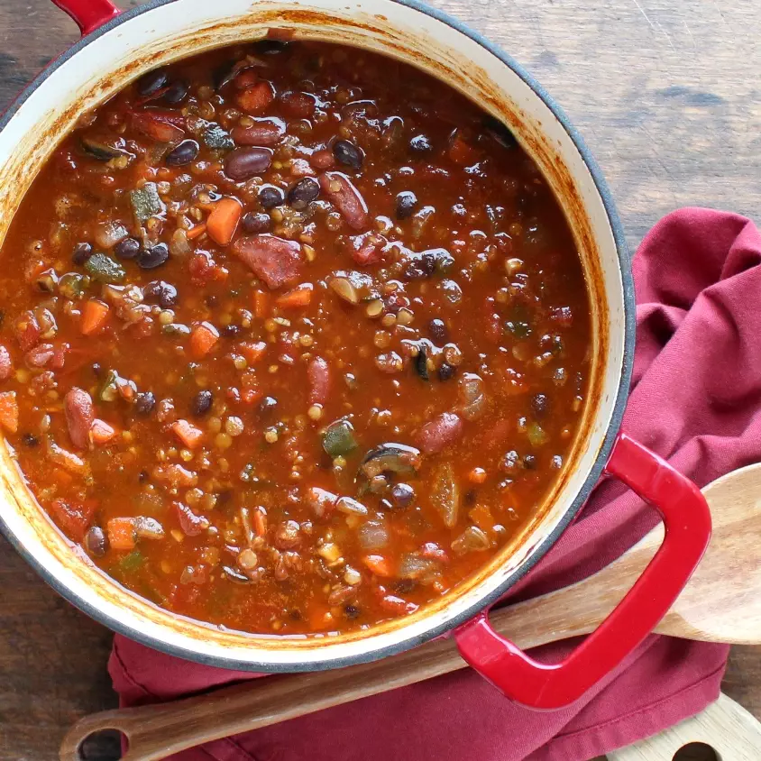 Overhead view of Vegetarian Chili with Red Lentils in a Dutch oven