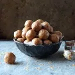 Blue bowl containing Peanut Butter Cookie Dough Energy Bites