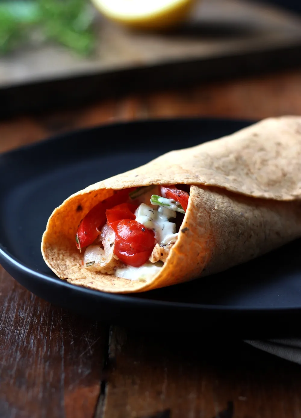Warm Tzatziki Chicken Wraps - Mediterranean flavors all wrapped up with warm chicken in a healthy wrap recipe. So good!