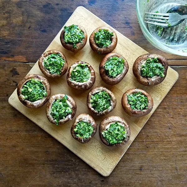 Stuffed Mushrooms with Spinach and Parmesan - Easy to make, and healthier stuffed mushrooms. This recipe is the perfect appetizer when you want something elegant and delicious.