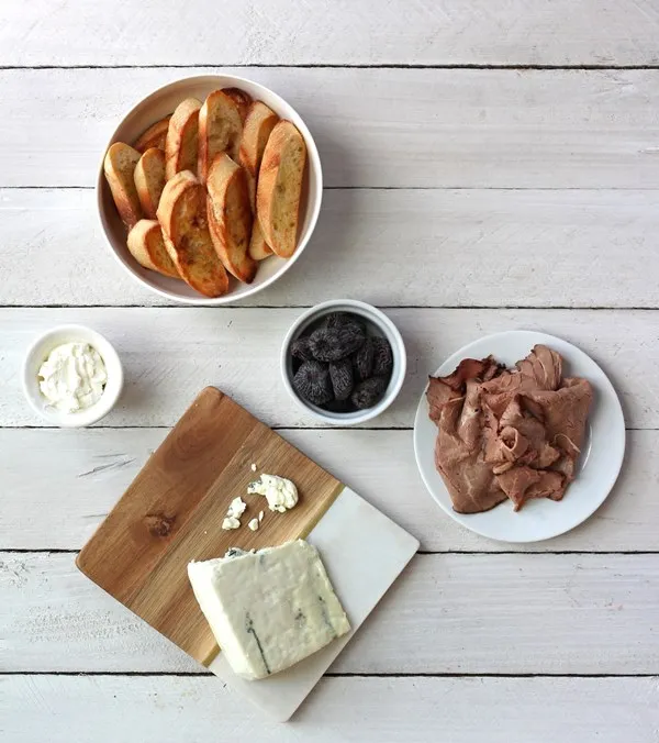 Ingredients for roast beef, fig, and blue cheese crostini snack