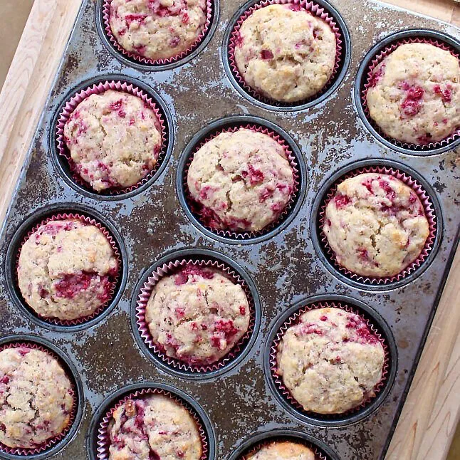 Raspberry muffins in muffin pan from the top