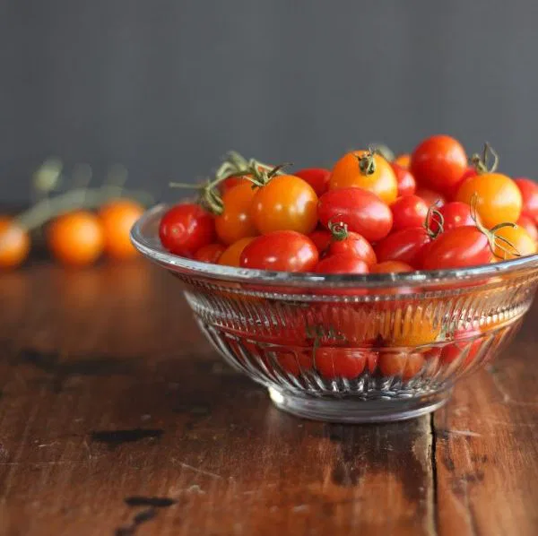 Bowl of red and yellow grape tomatoes