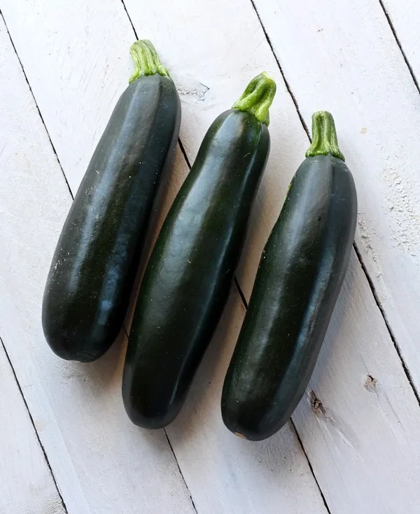 Picture of 3 zucchini squash on white background