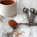 Southwest seasoning in a tablespoon on a marble background