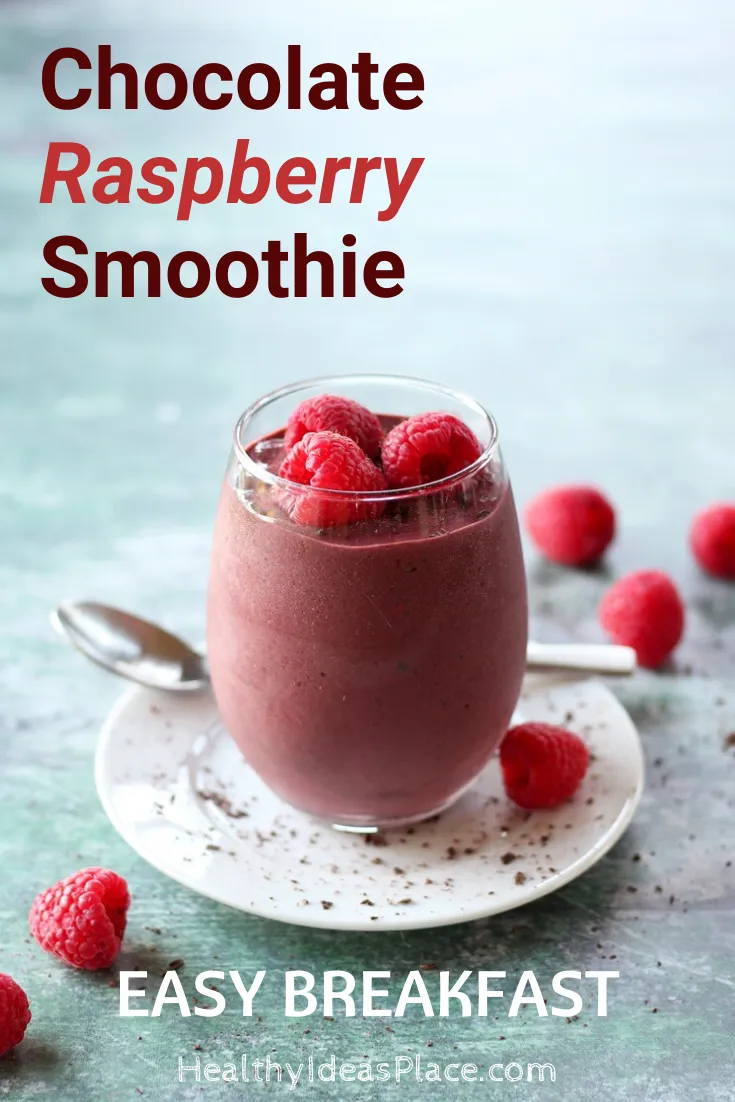 berry and chocolate smoothie in clear glass on white plate