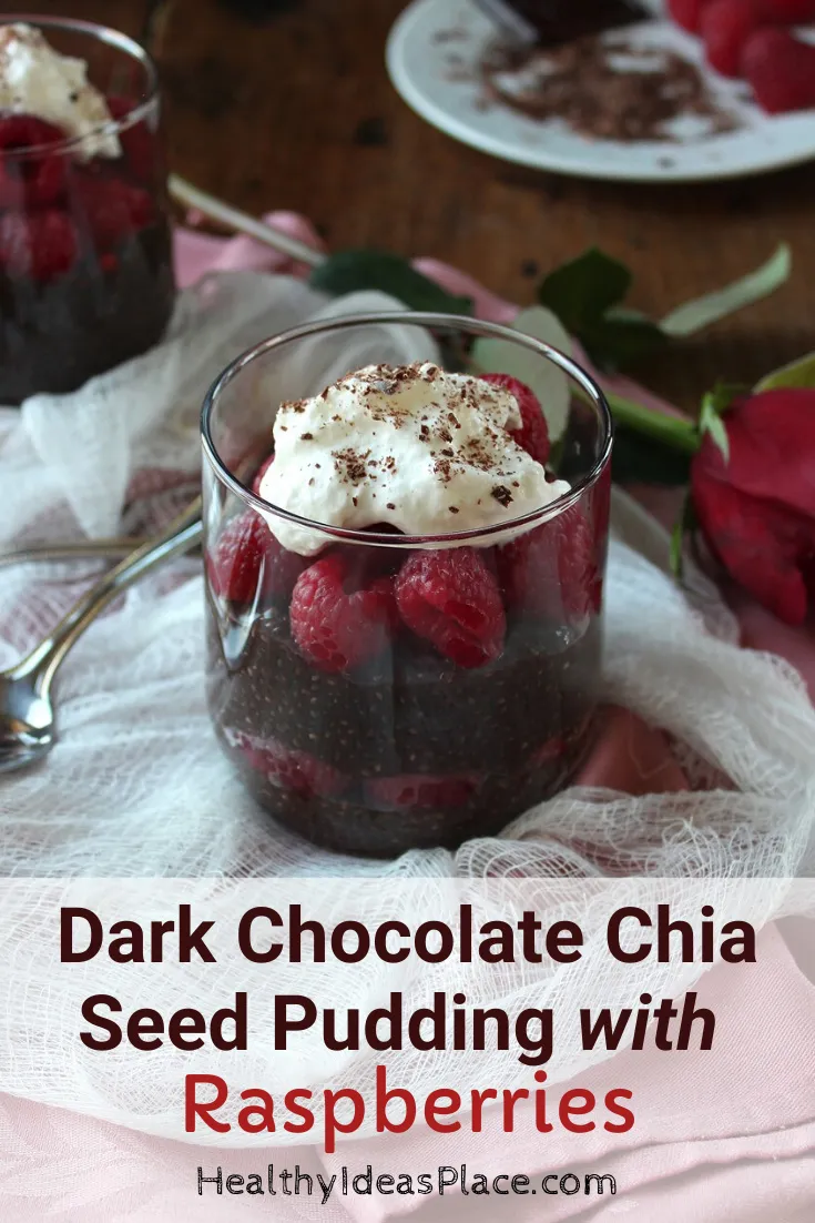 Dark chocolate pudding dessert with raspberries in clear glass