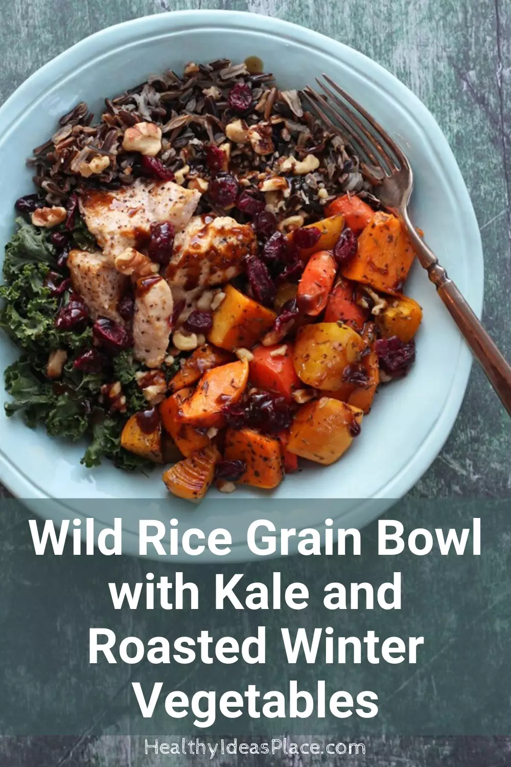 Teal bowl with kale, wild rice, winter vegetables, and chicken