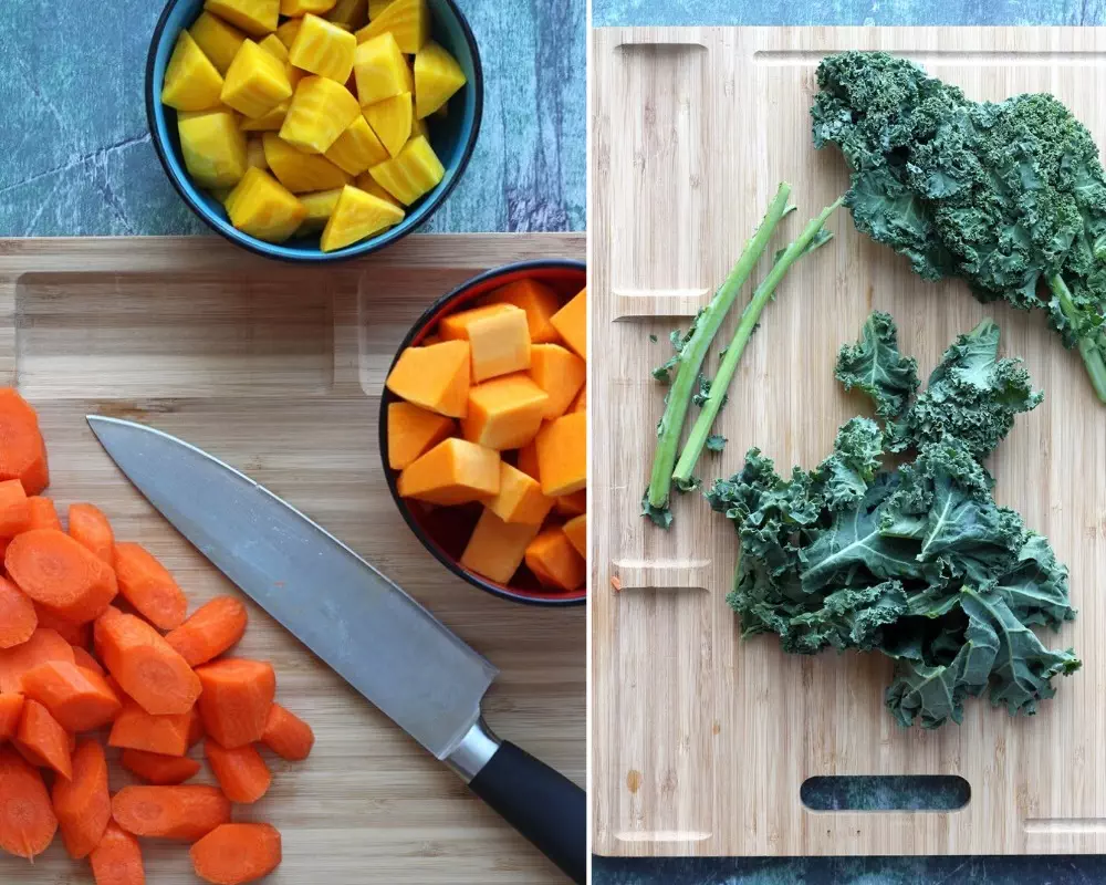 Carrots, squash, beets, and kale on cutting boards