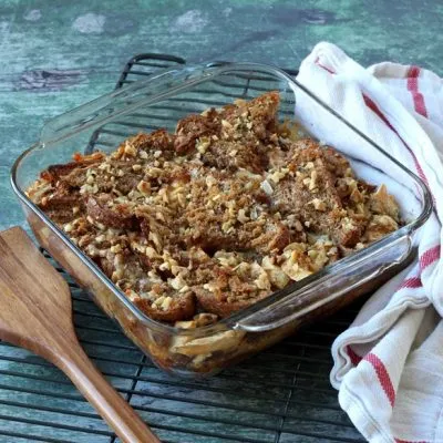 Baked French toast casserole in clear baking dish on wire cooling rack