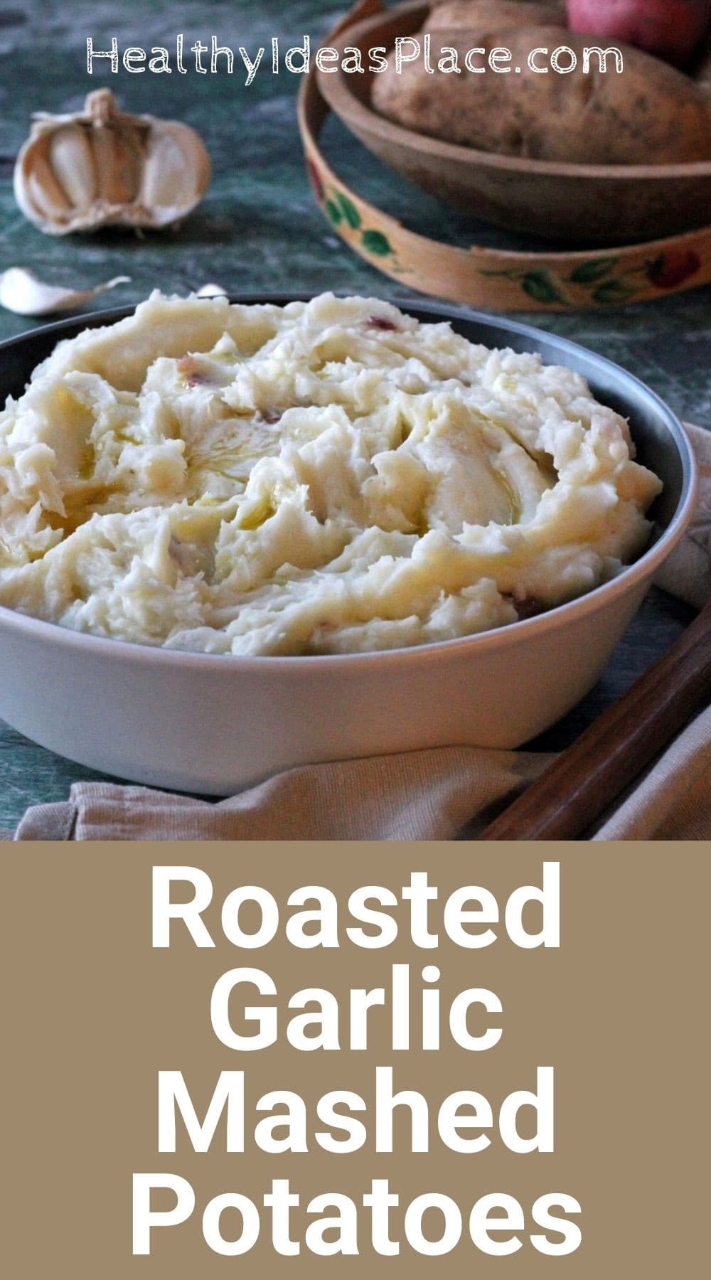Mashed potatoes in a bowl with raw potatoes in background