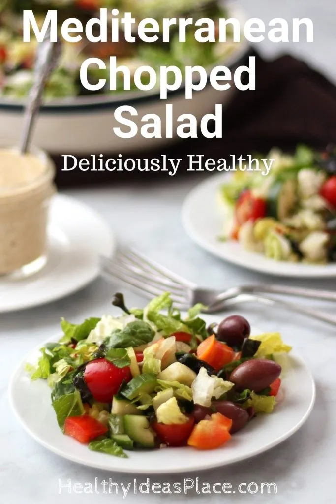 small white plate holding salad ingredients against a white background