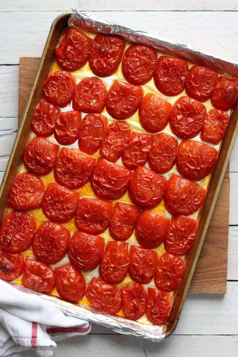 roasted tomatoes on rimmed pan