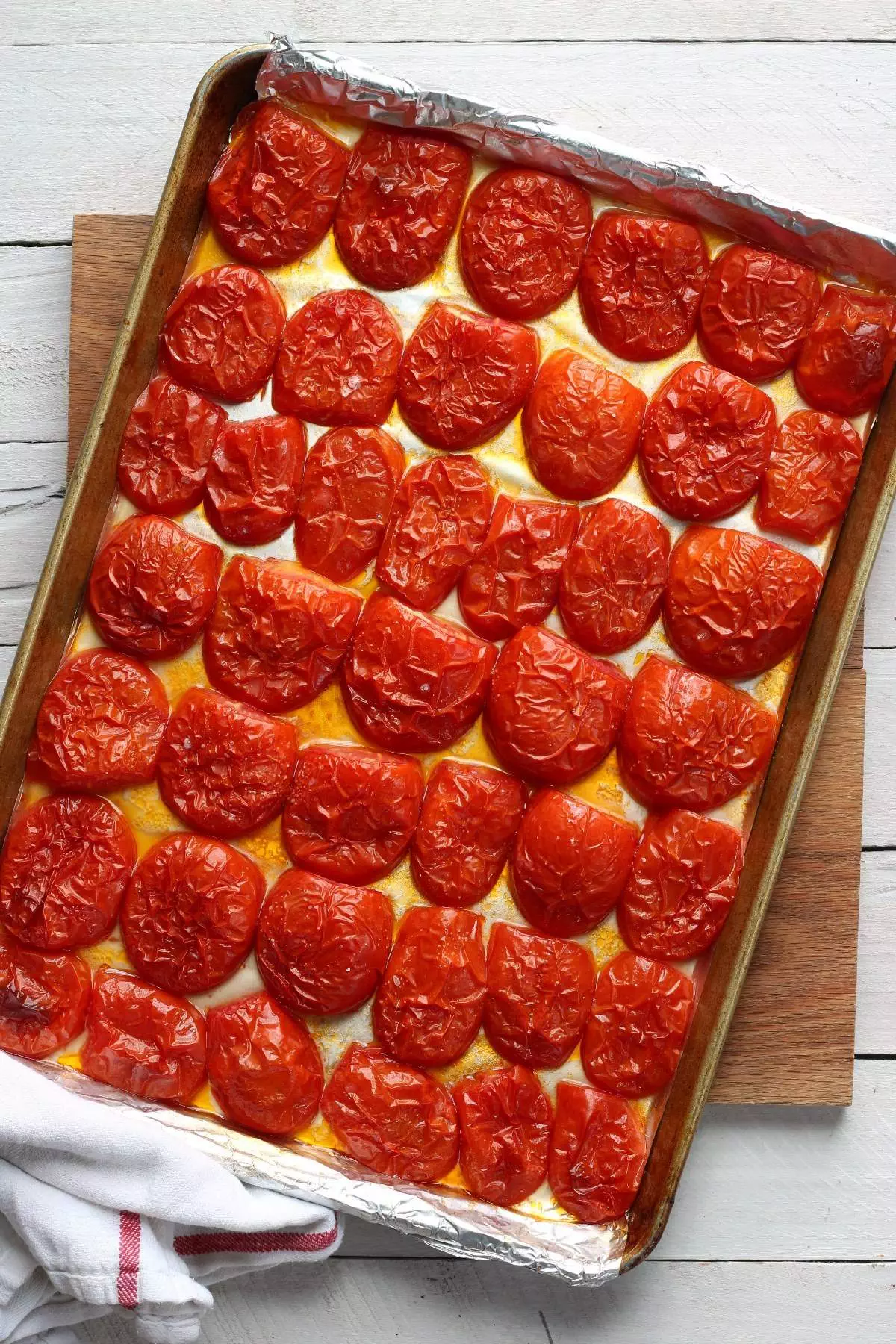 roasted tomatoes on rimmed pan
