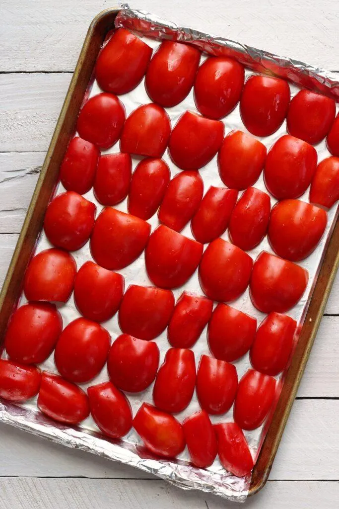 Halved tomatoes on pan