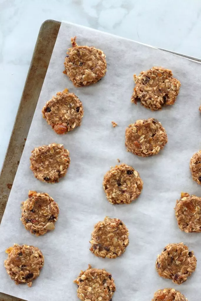 Raw breakfast cookie dough on parchment paper lined pan
