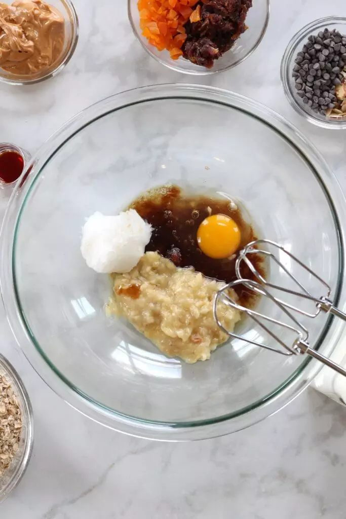Wet ingredients for oatmeal cookies in clear bowl