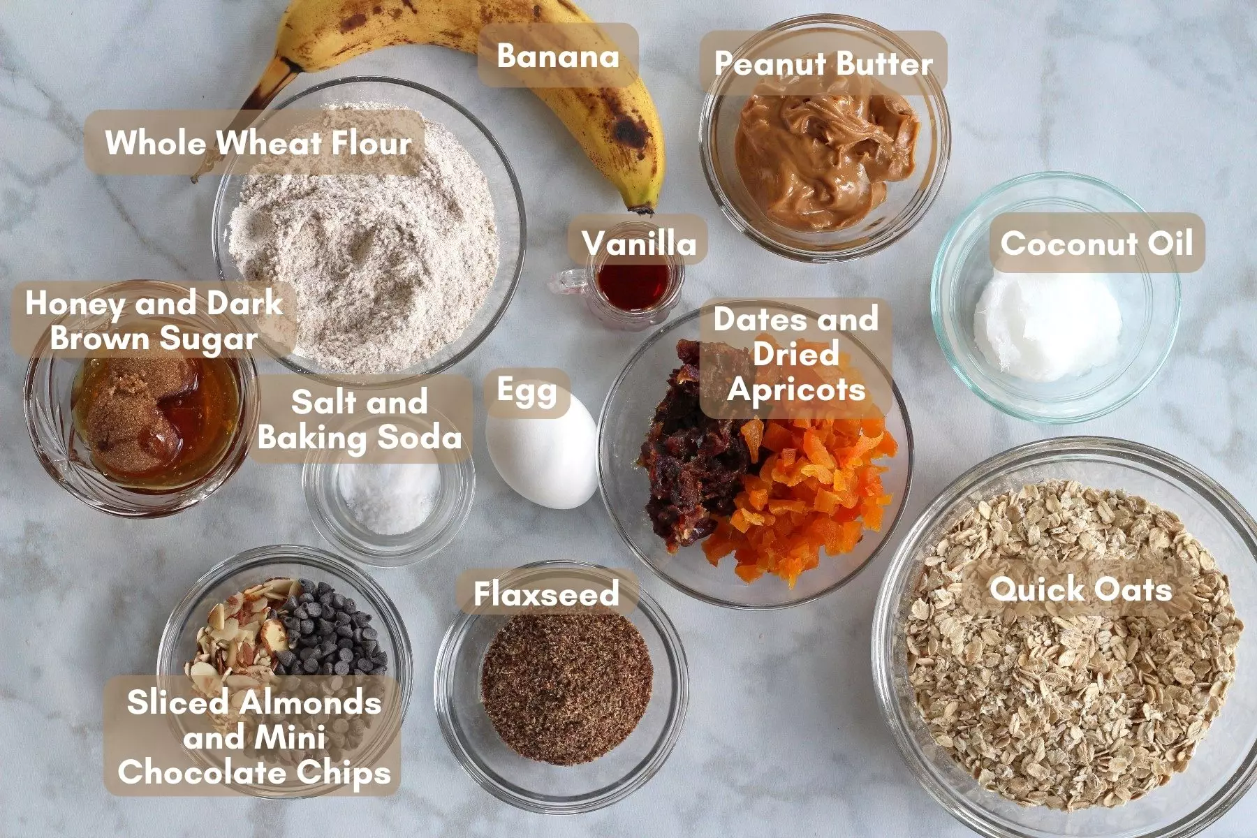 Ingredients for breakfast cookies, labeled, on white background